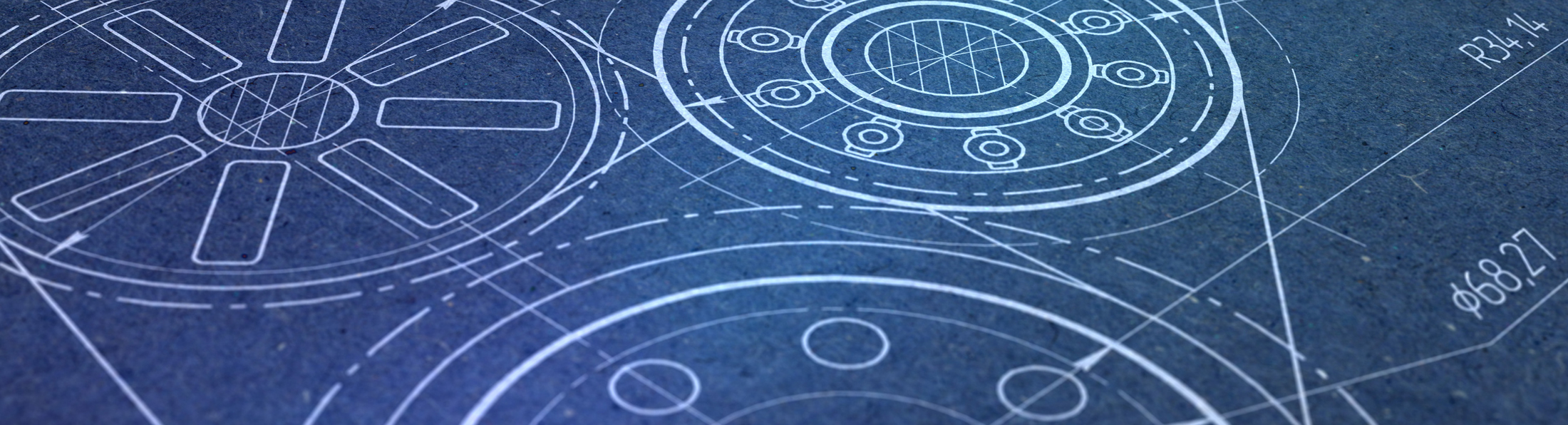 Close-up eines technischen Plans mit zwei abgebildeten Rädern, die die Konstruktion darstellen.