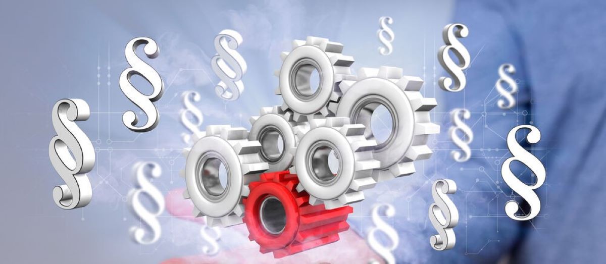 Paragraphenzeichen und Maschinenräder