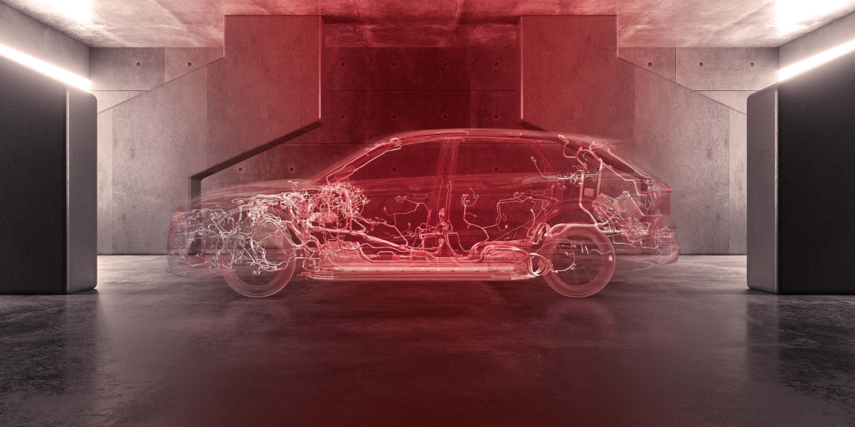 Das Bild zeigt in rotes Farbe getaucht ein Auto (Audi) welches transparent ist, sodass der Kabelsatz im Auto zu sehen ist.