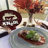 Essen der Veranstaltung - Knödel-Trio mit Tomatensoße