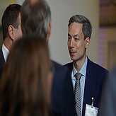 Mr. Börner speaking to other guests