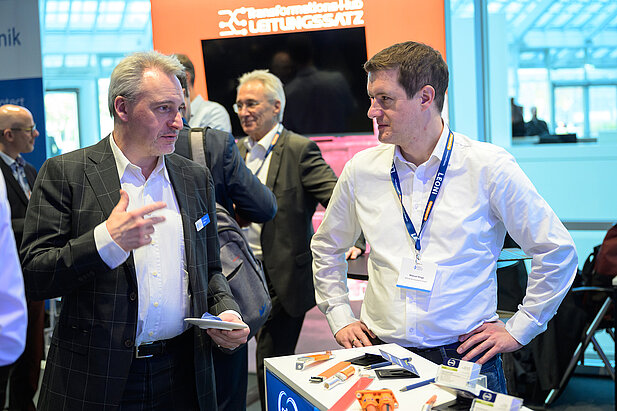 Dr. Andreas Böhm von Bayern Innovativ und ein Aussteller beim Kooperationsforum Bordnetze 2025