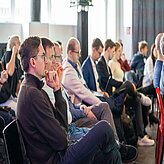 People in the audience listening to the speaker on the Thinknet 6G Summit