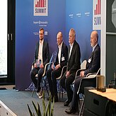 The Plenum Discussion with three speakers on the stage