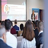 Speaker Christina Gessner talking to the 6G plenum