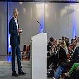 Das Bild zeigt Dr. Markus Wittmann auf dem 1. Scale-MX Kongress