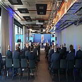 The full plenum from the back with the stage in the end