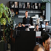 The head of the technicians team holding the printet agenda