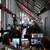 A look over the shoulders of the direction into the plenum and on the stage