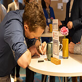 Picture of a person writing a note for the Networking Wall.