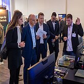 Dr. Alexandra-Gwyn Paetz at a booth on the Thinknet 6G Summit