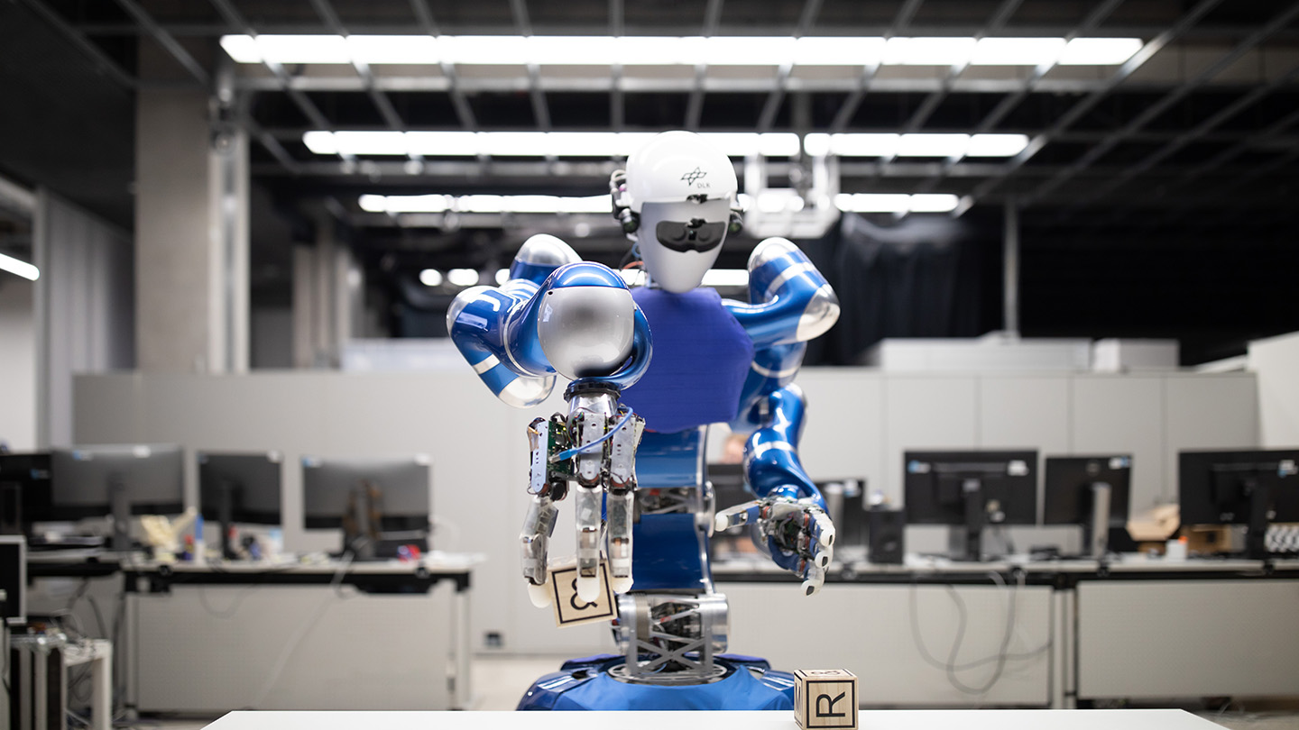 Agile blue robot, Justin in learning workshop